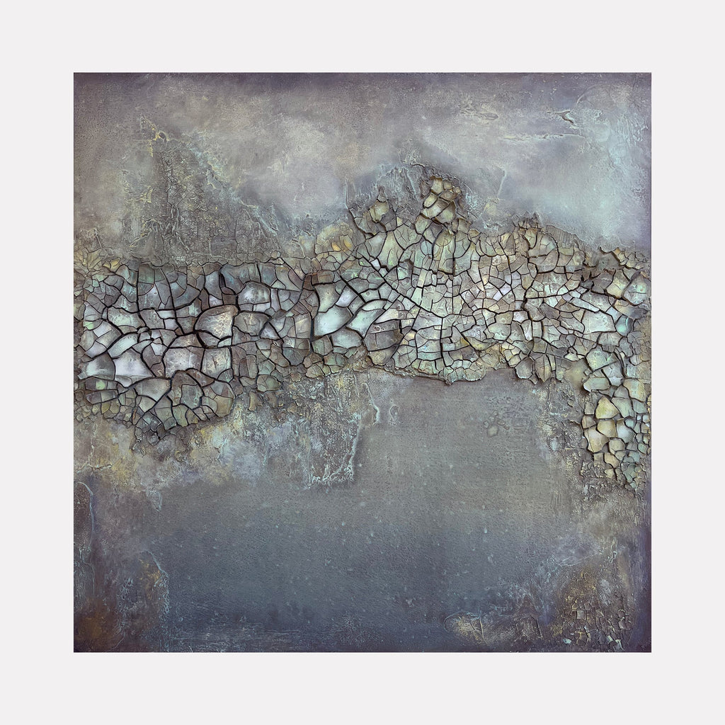 The artwork "Glass Sea" by Abbey Stace presents a textured abstract composition with cracked, mosaic-like forms in muted blues, greys, and soft earth tones layered over a foggy, atmospheric background. Its tactile surface and subtle depth evoke natural mineral formations, reminiscent of Anselm Kiefer's materiality and Agnes Martin's contemplative abstractions.