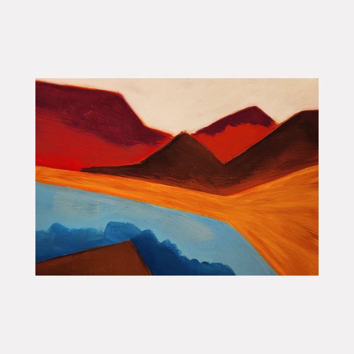 The artwork 'Hide & Seek' features an abstract landscape with bold angular mountains in deep burgundy and brown tones against a warm beige sky. A vibrant orange terrain sweeps across the foreground, meeting a striking blue water body that curves through the composition. Painted in acrylic gouache by Joanie Flickinger.