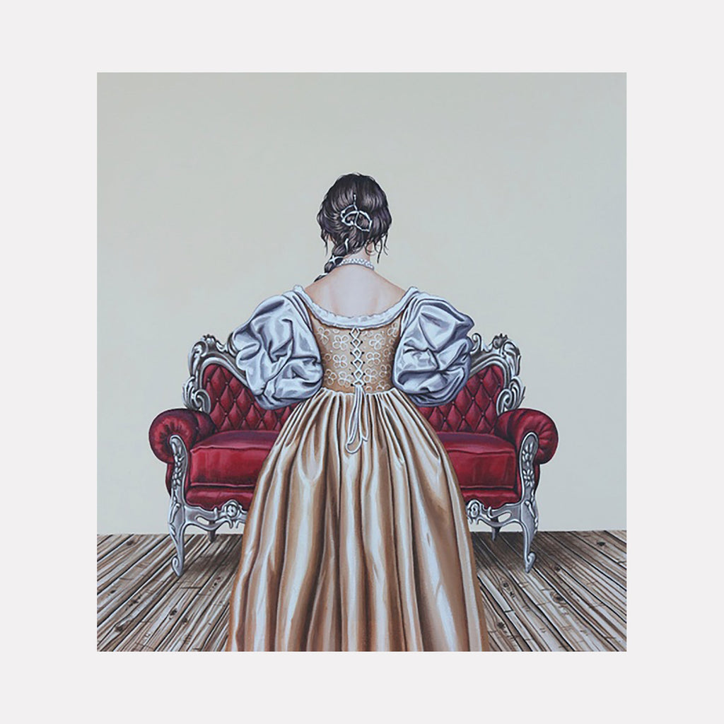 The artwork "Home Decor, Red Furniture" features a detailed painting of a woman in an elegant gold and white historical dress, standing with her back to the viewer in front of a luxurious red velvet tufted loveseat with ornate silver wooden trim, set on a wooden floor. Carlos Gamez de Francisco.
