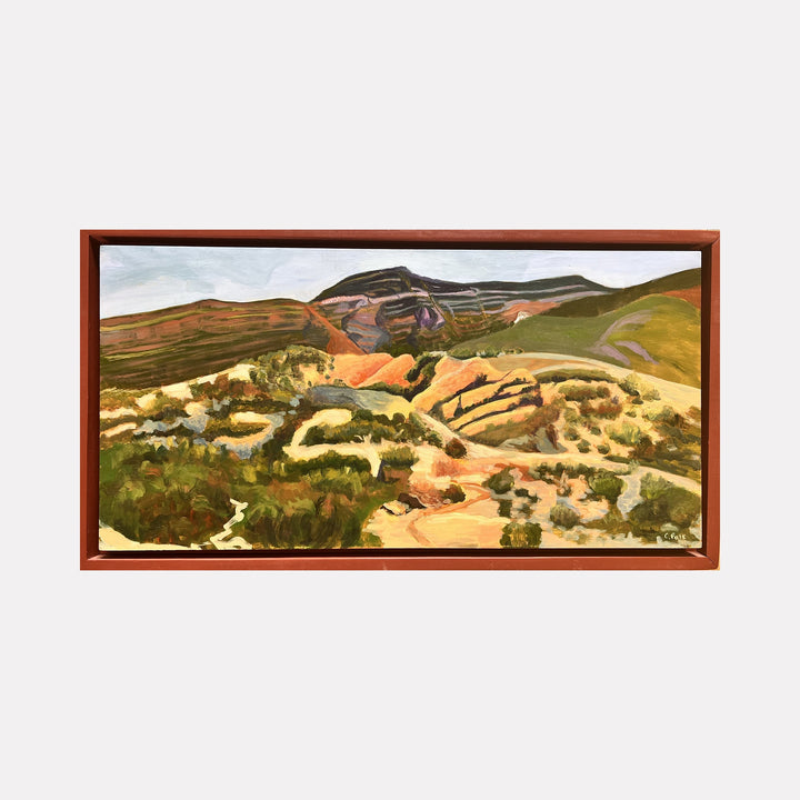 The artwork "Honey Mountains 1" by Connie Falk features a warm landscape with rolling hills and rugged terrain rendered in earthy tones of gold, green, brown, and hints of purple. The painting combines textured brushstrokes reminiscent of the Post-Impressionist style seen in works by Vincent van Gogh and Paul Cézanne, capturing both natural detail and abstract form.