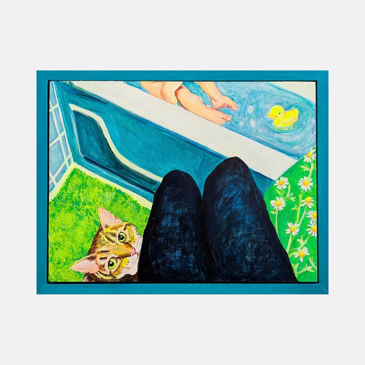 The artwork "I'll Be Watching You" by Mary Younkin depicts a vibrant scene with a cat peeking curiously beside a pair of dark-clad legs, overlooking a bathtub with a rubber duck and a child's feet visible in the water. The piece blends bold colors and textures reminiscent of domestic realism and the playful intimacy found in works by David Hockney. Mary Younkin.