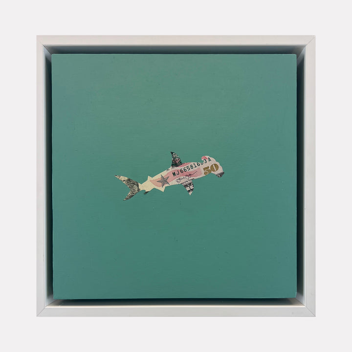 The artwork "Spirit Messengers, Hammerhead" by Jacki Davis features a hammerhead shark crafted from US currency and acrylic on a teal wood panel measuring 8 by 8 inches. The shark combines textured currency details with a smooth painted background, blending mixed media elements into a minimalist, modern design.