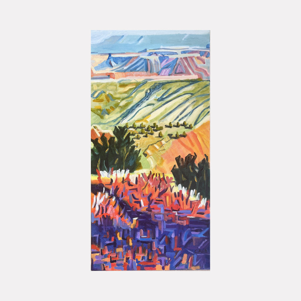 The artwork "Jemez in the Distance" by Connie Falk features an abstracted landscape with layered bands of vibrant colors including purples, reds, greens, and blues. The textured brushstrokes and geometric shapes evoke styles reminiscent of Paul Cézanne's post-impressionist approach and David Hockney's vivid palette, blending natural scenery with expressive modernism.