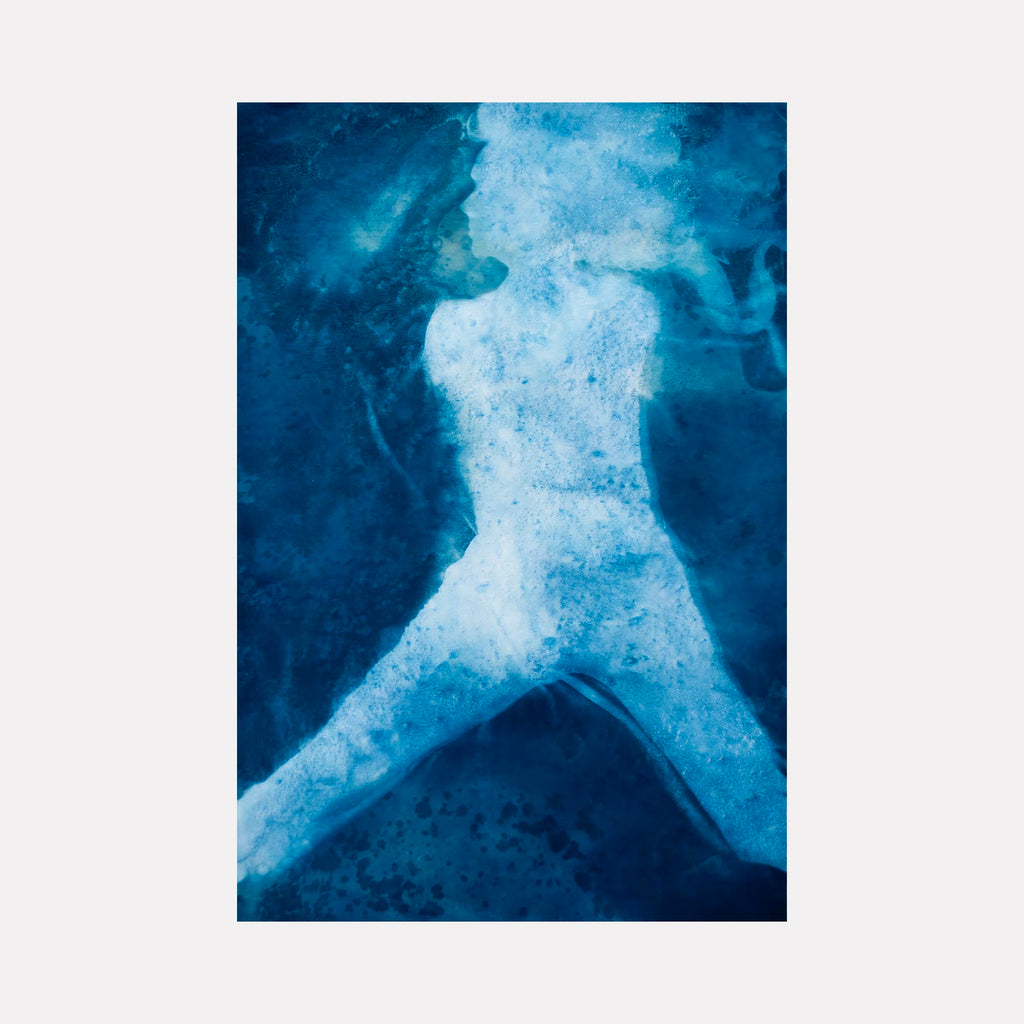 The artwork "Joan" by Cat Welch features an abstract human silhouette rendered in shades of deep and light blue, evoking impressions of water or ice textures. The style is reminiscent of Yves Klein's monochromatic works combined with the organic fluidity seen in Helen Frankenthaler’s color field paintings, creating a serene and contemplative visual experience.