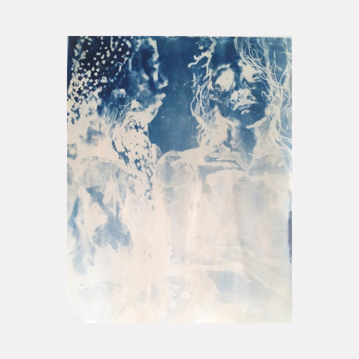 Heart to Heart by Johanna Ryan features an ethereal, monochromatic blue and white composition of two ghostly figures facing each other. Soft, flowing lines and textured details create a haunting, introspective atmosphere that invites quiet reflection on connection and presence.
