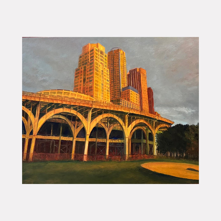 The artwork "Last Light, Riverside Park South" by Jessica Ziegler captures a cityscape bathed in warm golden light with tall buildings rising above a curved, arched structure. The style blends realism with impressionistic brushstrokes reminiscent of Edward Hopper's urban scenes, using rich textures and a muted sky to evoke a serene yet vibrant evening atmosphere.