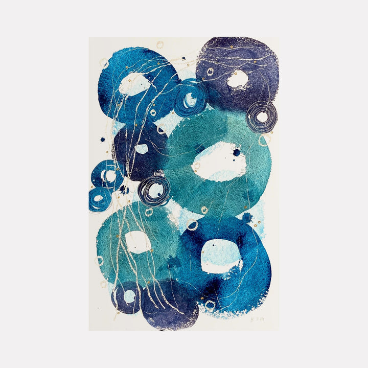 The artwork 'Little Ripples II' by Jocelyn Benford features abstract circular forms in varying shades of blue and teal, creating a fluid, aquatic-inspired composition. White negative spaces and delicate linear details dance through the watercolor spheres, suggesting movement and depth. The mixed media technique adds textural complexity to the ethereal underwater-like design.