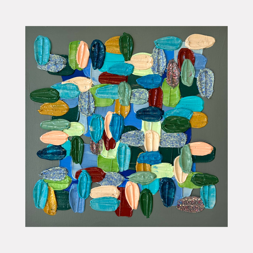 Miami Blue by Shiri Phillips features an arrangement of thick, textured brushstrokes in vibrant blues, greens, creams, and warm reds atop a muted grey background. The composition balances smooth and rough textures, creating an engaging abstract pattern that radiates a natural, dynamic energy with contemporary flair.