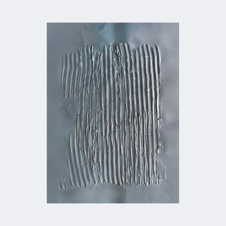 The artwork "Nuances of Depth 8" by Albion Vu features a textured abstract composition with vertical ridges and grooves rendered in shades of muted gray and silver. The tactile surface and minimalist approach evoke influences from artists like Lucio Fontana and Alberto Burri, emphasizing materiality and depth through layered, sculptural paint effects.