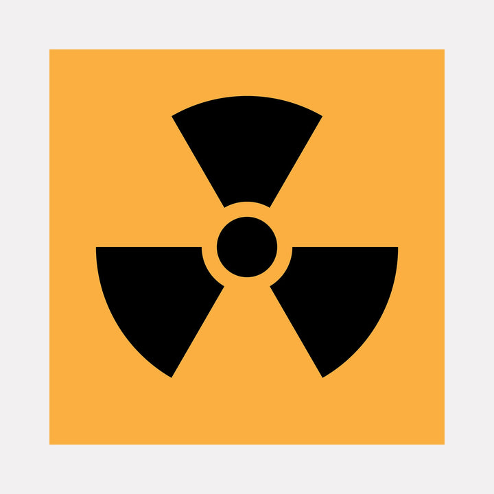 The artwork "NUKE" by Harold Herb features a bold black radiation symbol set against a vivid orange background. This large-scale mixed media piece uses stark geometric shapes and contrasting colors, reflecting graphic minimalism and drawing inspiration from modernist design and the iconic symbolism seen in pop art and industrial signage.