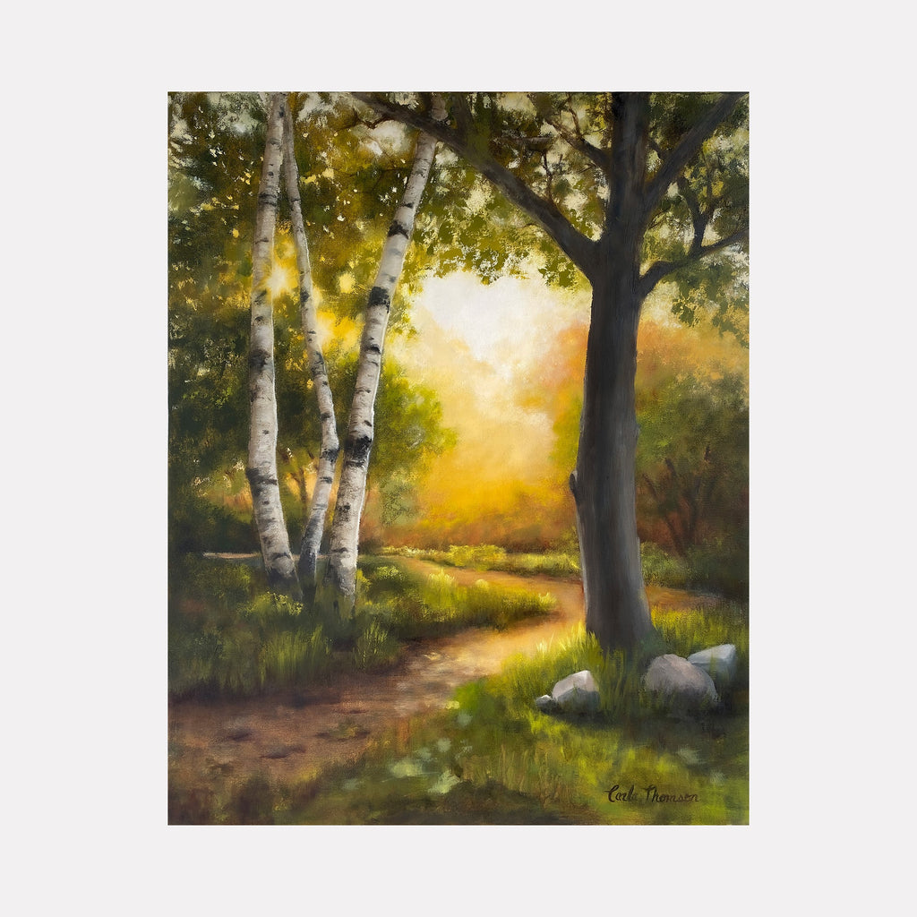 The artwork "New Direction" by Carla Thomson depicts a serene forest scene with a winding dirt path leading into a glowing, sunlit background. The painting features textured birch and oak trees with detailed bark, soft green foliage, and a warm color palette reminiscent of the natural realism style seen in works by artists like Albert Bierstadt and the Hudson River School.