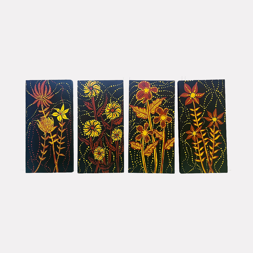Night Garden by Sunny Chapman is a Curina art piece featuring four panels with stylized flowers in warm reds, yellows, and oranges on a deep blue background, accented by delicate dotted patterns creating a lively, textured abstract floral design.