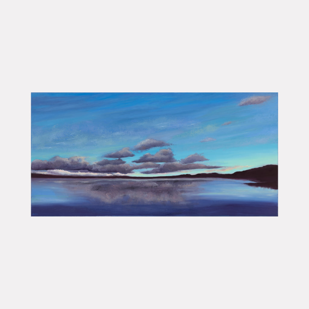 Other Worldly Glow by Nadia Parsons depicts a tranquil lake under a vast sky with soft clouds and subtle light transitions, blending serene blues and purples to evoke a peaceful, ethereal atmosphere in this captivating landscape art piece.