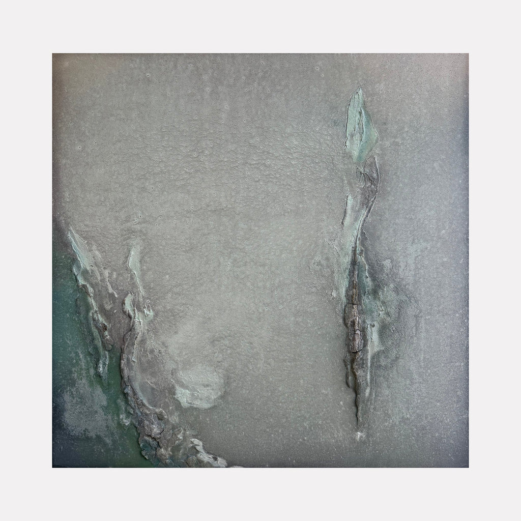 The artwork "Pilar of Salt" by Abbey Stace presents an ethereal abstract in muted greys and soft greens, featuring delicate fissures and layered textures that evoke mineral formations or weathered stone. Its subtle depth and understated palette recall the contemplative abstractions of Agnes Martin and the natural textures found in Anselm Kiefer's landscapes.