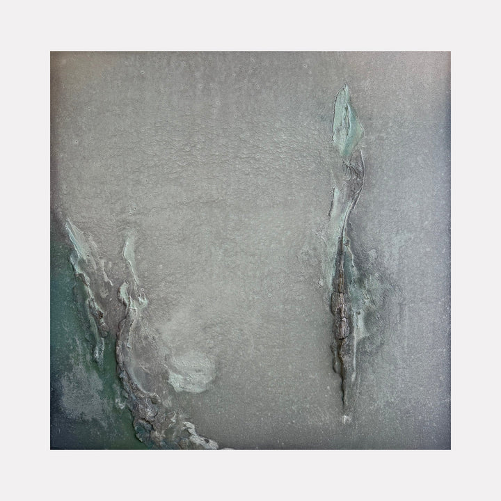 The artwork "Pilar of Salt" by Abbey Stace presents an ethereal abstract in muted greys and soft greens, featuring delicate fissures and layered textures that evoke mineral formations or weathered stone. Its subtle depth and understated palette recall the contemplative abstractions of Agnes Martin and the natural textures found in Anselm Kiefer's landscapes.