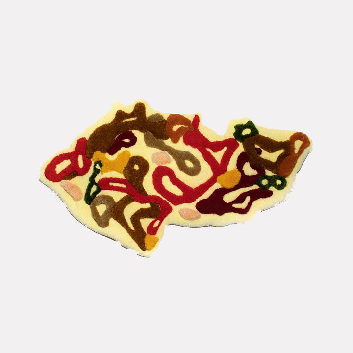 The artwork "Prague" by Abigail Henthorne features an abstract, irregularly shaped tufted textile piece with looping organic forms in warm browns, deep reds, olive green, and muted ochre set against a soft cream background. Its tactile layering and earthy palette evoke the gestural abstraction of Willem de Kooning and the fluidity of Joan Miró’s biomorphic shapes.