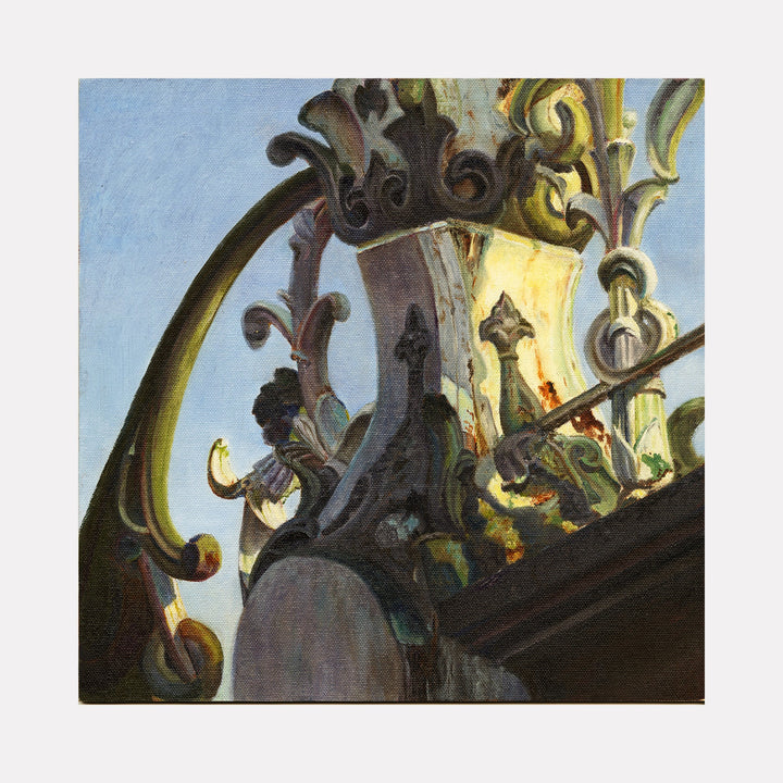 The artwork "Cast Iron Bridge: Railing in a Cerulean Sky" by Jessica Ziegler depicts a detailed close-up of ornate cast iron railings against a bright blue sky. The intricate swirling patterns and textures evoke styles similar to Art Nouveau and echoes the decorative elegance found in works by Gustav Klimt and Antoni Gaudí.
