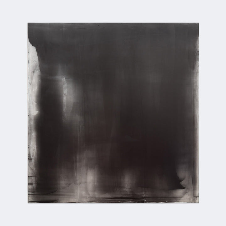 The artwork "Graphite Veil 3" by Debra Ramsay features a large square composition dominated by deep graphite tones with subtle gradients and smoky textures. The dark, moody surface evokes the atmospheric intensity reminiscent of Mark Rothko’s color field paintings and Gerhard Richter’s abstract works, blending softness with a bold, minimalist aesthetic.