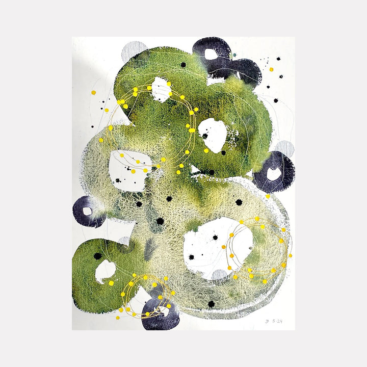 The artwork 'Rejuvenation' by Jocelyn Benford features organic swirling shapes in moss green watercolor with deep navy circular accents. Abstract composition displays fluid brush strokes, delicate yellow dotted lines, and white negative spaces creating a dynamic interplay of light and shadow. Splattered ink details add depth to this mixed media piece on paper.