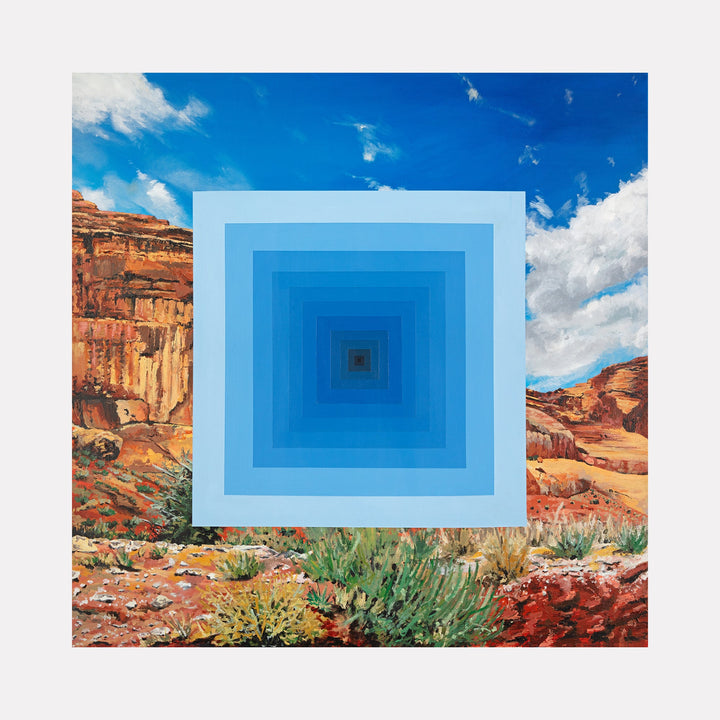 The artwork "Rings Within Rings" features concentric squares in varying shades of blue, creating a tunnel-like optical illusion. This geometric design contrasts with a vivid desert landscape background, showcasing red rock formations, green shrubs, and a bright blue sky with clouds. By Adam Anglin.