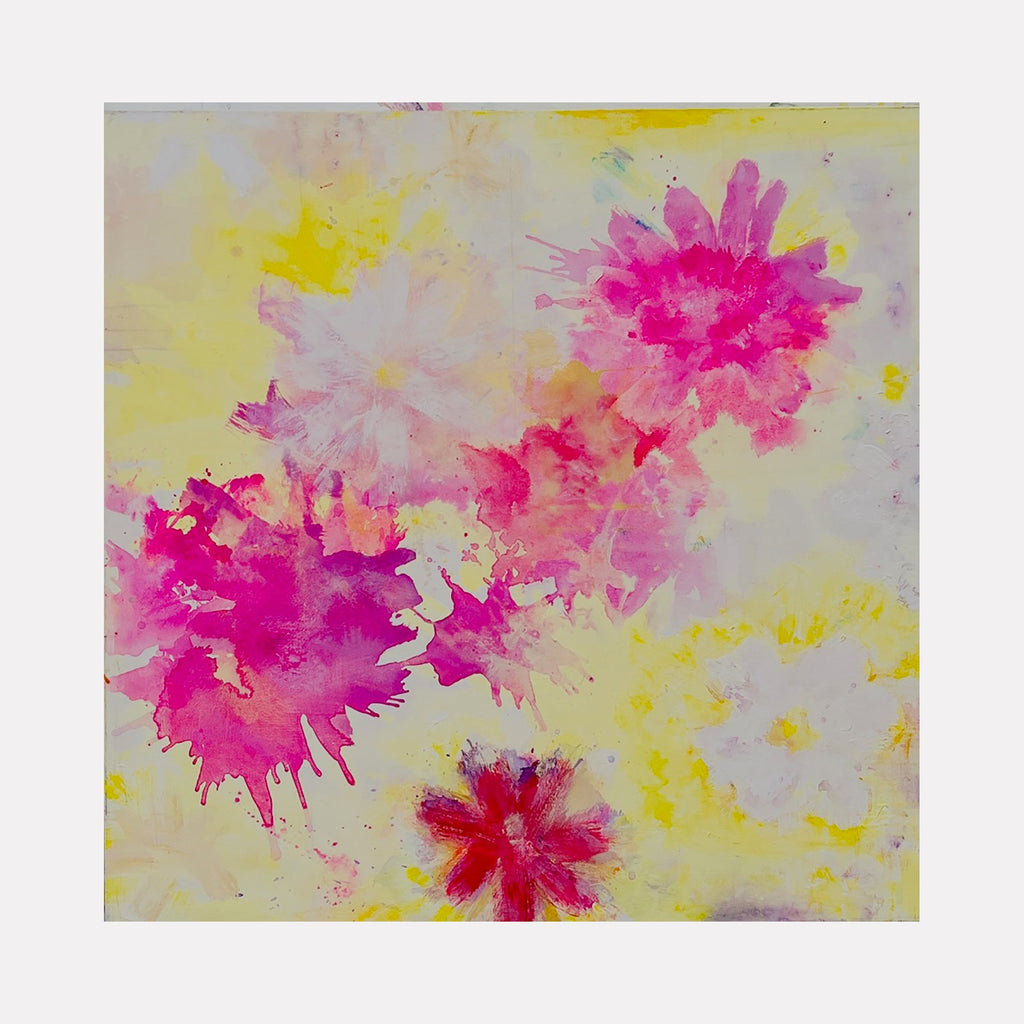 The artwork "SUMMER DAY" features vibrant watercolor-like floral shapes in shades of pink, red, and purple with soft yellow and white background accents creating a light and airy atmosphere. The abstract style emphasizes fluid textures and splashes that evoke a lively summer mood. By Amadea Bailey.