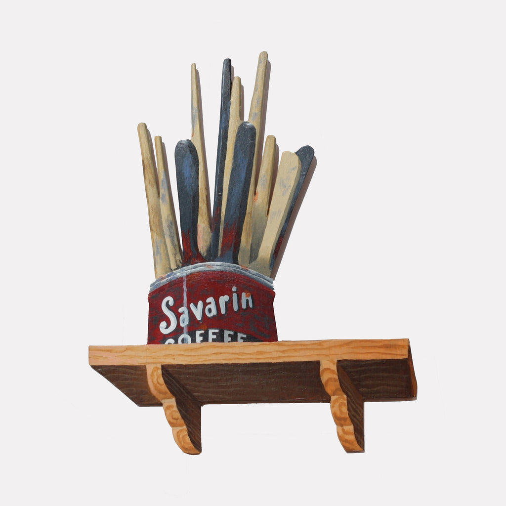 The artwork "Savarin" by Carl Chaiet in gallery position 1 features a three-dimensional sculpture of a weathered red coffee can filled with tall, vertically arranged paintbrushes in muted blues and beige tones atop a rustic wooden shelf. Its nostalgic Americana charm and sculptural form evoke the folk art sensibility of Betye Saar and the textured whimsy of Joseph Cornell.