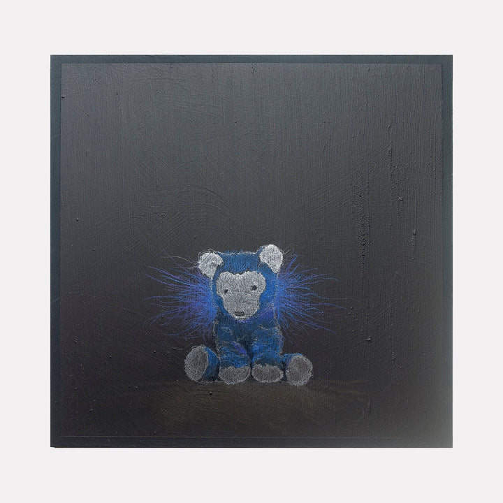 The artwork "All you can truly own is your shadow 10" by Ken Schiano features a small, textured teddy bear rendered in shades of blue and gray, set against a dark, almost black background. Blue radiating lines surround the bear, creating a subtle glowing effect that contrasts with the matte surface. The piece combines simplicity with an abstract, emotive style. Ken Schiano