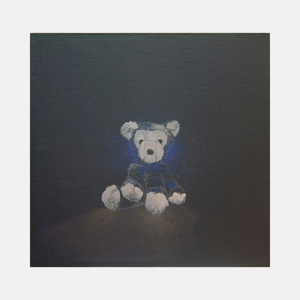 The artwork "All you can truly own is your shadow 5" by Ken Schiano features a softly illuminated teddy bear sitting against a dark, textured background. The bear's light gray and blue tones create a gentle contrast, highlighting its detailed fur and expressive, shadowed face, evoking a sense of solitude and introspection. Ken Schiano.