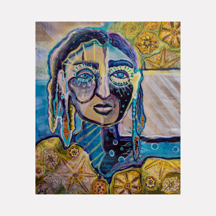 The artwork "She Determines Her Own Destiny" depicts a stylized female face with expressive eyes and textured, flowing hair in shades of blue, purple, and gold. Surrounding the figure are intricate, star-like patterns in warm tones of yellow and orange, contrasted with cool teal and beige backgrounds. The piece features layered brushstrokes and mixed media textures. Laurie Shapiro