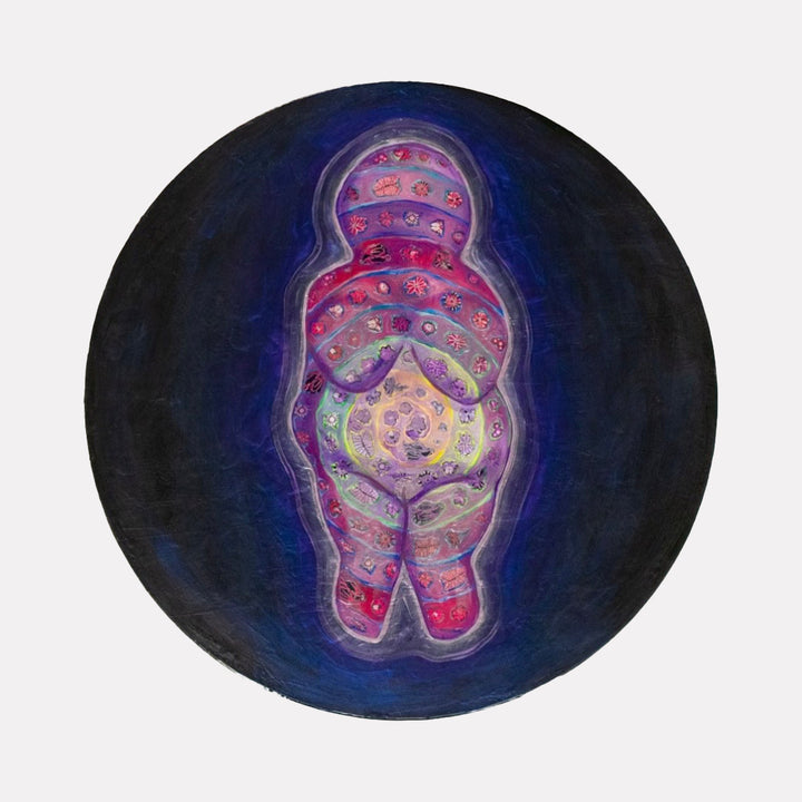 The artwork "She's Got the Whole World in Her Womb" depicts a rounded, abstract female figure with a vibrant pattern of red, purple, green, and yellow hues, featuring floral and celestial motifs. The figure is outlined with a glowing aura against a dark blue circular background. Laurie Shapiro.