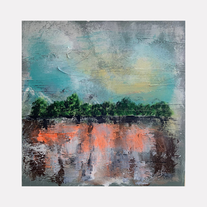 The artwork "Simple Beauty" by Tammy Kushnir features an abstract landscape with textured brushstrokes in muted teal, grey, and soft yellow tones for the sky. Dark green tree shapes form a horizontal line above a reflective, earthy surface with warm orange and brown hues, creating a serene and balanced composition.