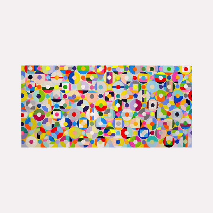 The artwork "Synchronicity" by Benna Holden features a vibrant composition of overlapping circles, squares, and geometric shapes in a kaleidoscope of colors including red, yellow, blue, green, and purple. The style is reminiscent of Wassily Kandinsky’s abstract pieces, with a playful yet complex arrangement evoking a sense of rhythm and balance.
