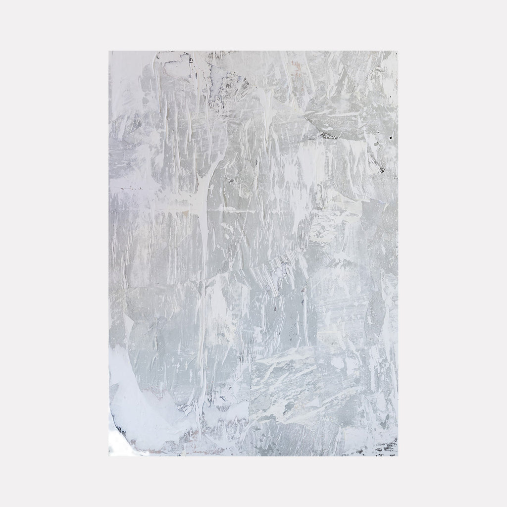 The artwork "TAFD Silver" by Amy Turner features a textured abstract composition in varying shades of gray and silver with layered, weathered surface elements. The subtle interplay of light and shadow, along with the rough, tactile application, evokes minimalist and industrial abstraction reminiscent of works by Robert Ryman and Agnes Martin.
