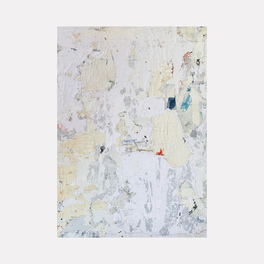 The artwork "TAFD Textured Light" by Amy Turner features a delicate abstract composition with layered textures in soft creams, whites, and subtle grays, punctuated by hints of muted blue and faint red. The tactile, weathered surface evokes a quiet, natural erosion reminiscent of the textured abstractions by Robert Ryman and Cy Twombly.