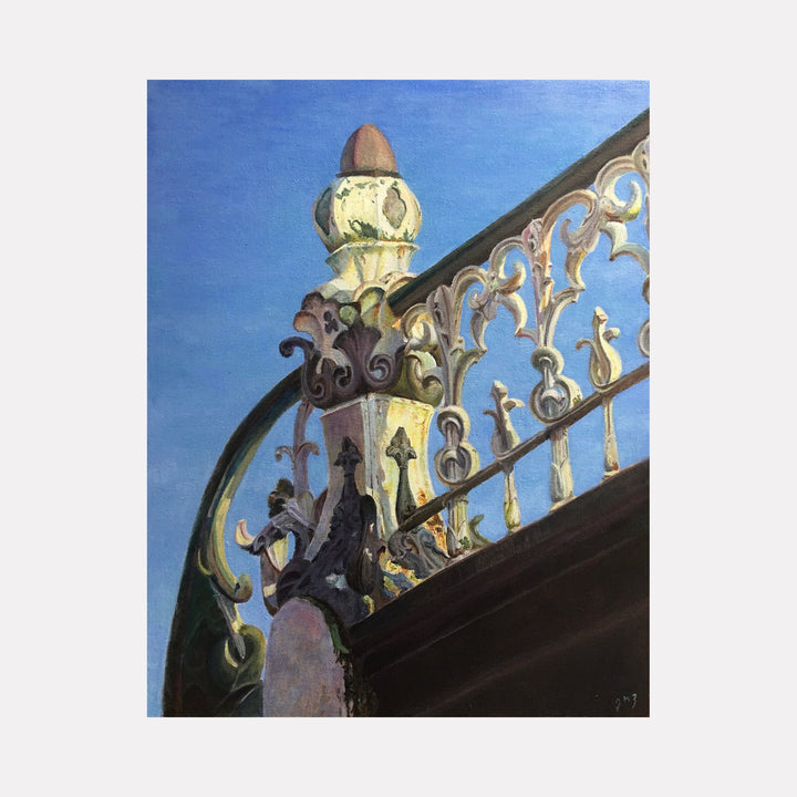 The artwork "Textures of History: Sunlit Ironwork" by Jessica Ziegler showcases an ornate wrought iron fence bathed in warm sunlight against a clear blue sky. The intricate ironwork features elegant curves and decorative finials reminiscent of Art Nouveau styles, drawing parallels to the craftsmanship seen in works by Alphonse Mucha and the architectural details of Antoni Gaudí.
