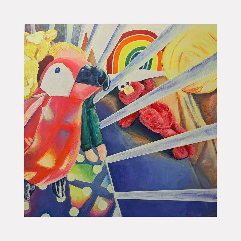 The artwork "The Comforts We Keep" depicts a vibrant scene with a colorful parrot holding a plush doll, alongside a red Elmo toy, set against a background featuring a rainbow and radiating beams of light. The style combines elements reminiscent of Pop Art and the playful use of bright colors akin to works by David Hockney. By Mary Younkin.