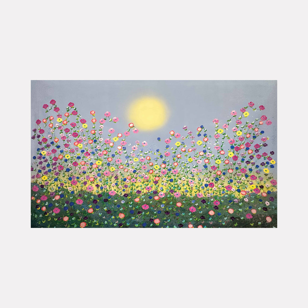 The artwork "The Happiness Factor" by Dorothea Sandra features a vibrant floral landscape under a soft glowing sun. Colorful, loosely defined blossoms in pink, yellow, and blue rise against a muted gray-blue sky, with textured layers evoking the joyful spontaneity of Joan Mitchell and the radiant color harmony of Georgia O’Keeffe’s floral studies.