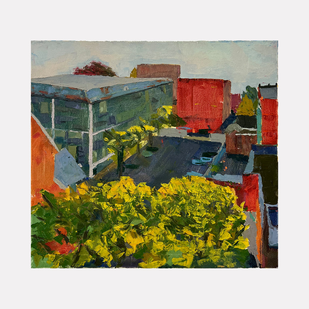 The artwork "The Shortcut" by Catherine Webb depicts an urban landscape with bright yellow foliage in the foreground leading to angular buildings in muted reds and grays. The textured brushwork and sunlit palette evoke the atmospheric clarity of Edward Hopper’s cityscapes and the modernist geometry seen in early Charles Sheeler paintings.