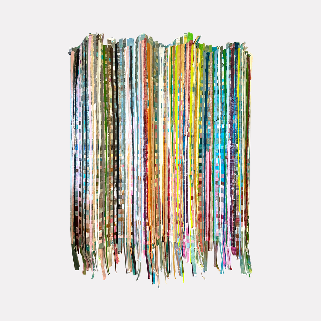 They Are Home by Shiri Phillips features a vertical arrangement of multicolored, woven fabric strips with varying patterns and textures. The layered composition creates a vibrant, rhythmic flow that captures a lively, handcrafted essence, blending contemporary textile art with a dynamic, tactile presence.