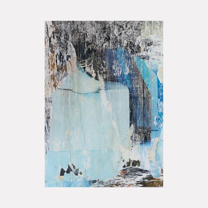 The artwork "Waterfall" features an abstract composition with layered textures and a mix of soft blues, grays, blacks, and whites, evoking the flow and fluidity of water cascading down. The piece combines rough and smooth surfaces with a painterly style that suggests natural erosion and movement. By Amy Turner.
