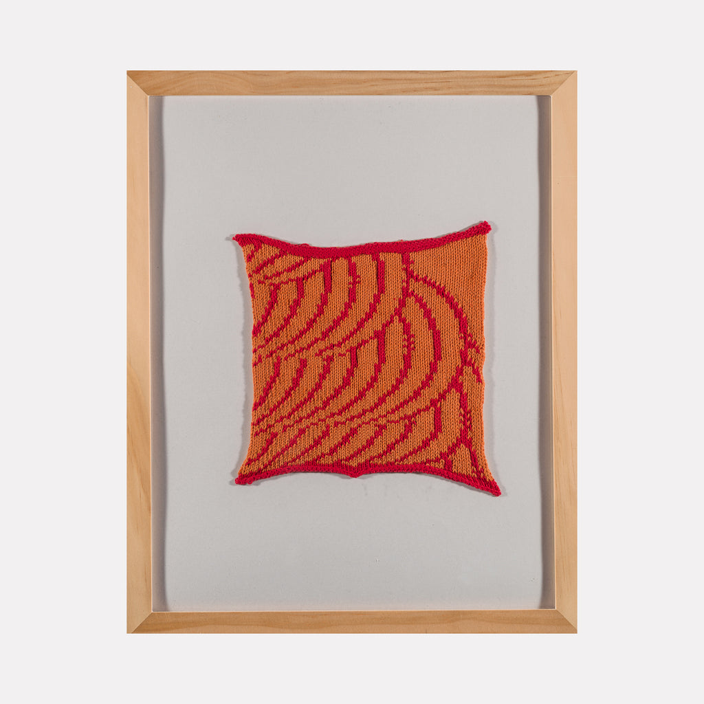 Waveform Drift (#1) by Craftwork showcases a framed textile artwork with bold red and orange curved patterns on a neutral background, blending tactile fabric texture and dynamic abstract shapes in a contemporary art style.