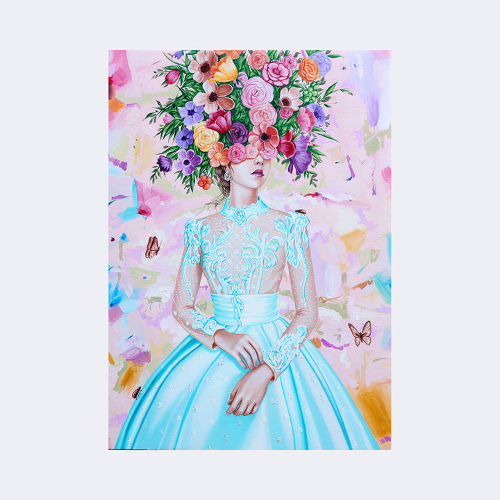 The artwork "Young Woman Among the Flowers I" by Carlos Gamez de Francisco features a delicate young woman in an intricately detailed turquoise lace dress. Her head is enveloped by a lush, vibrant bouquet of roses and other flowers in warm hues of pink, red, orange, and purple. Soft butterflies flutter nearby against a pastel, abstract background reminiscent of impressionist textures. The style evokes the elegance of Gustav Klimt's ornamental pat