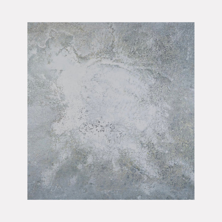 The artwork "#101" by Nathan Aufrichtig features an abstract gray landscape with textured layers evoking natural stone and weathered surfaces. The subtle interplay of light and shadow creates a serene, contemplative mood, reminiscent of the muted, atmospheric abstractions found in works by Agnes Martin and Mark Rothko.