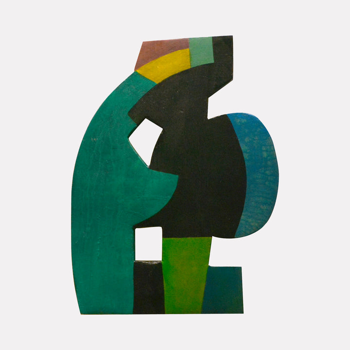 #20 by David Wellner presents an abstract, asymmetrical form featuring bold geometric shapes in deep green, black, blue, yellow, and brown tones. The layered surface texture and dynamic composition offer a modern, sculptural quality that explores balance through contrasting colors and interlocking elements.