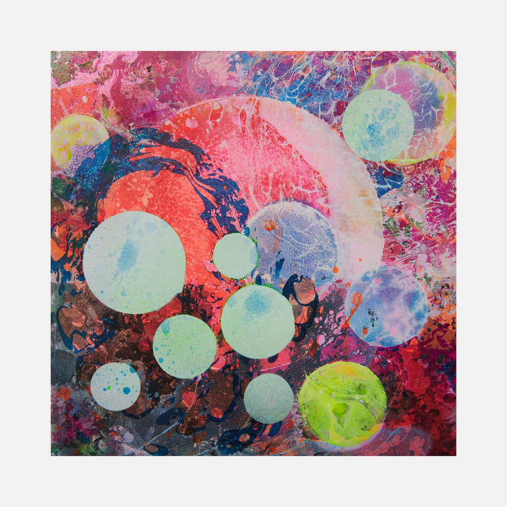 The artwork 'My World' by Millie Benson features vibrant floating spheres in pastel blues, mint greens, and coral pinks against a dynamic abstract background. The mixed media piece combines textural elements using gouache and spray paint, creating a cosmic, ethereal effect with layered circles dancing across a deep burgundy and navy base. 10x10 inch contemporary abstract art on wood.