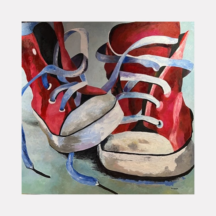 The artwork "The Discarded Ones" by Suyapa Quinn features a close-up depiction of worn red sneakers with loosely tied blue laces set against a muted, textured background. The painterly brushstrokes and expressive use of color evoke a figurative style reminiscent of Alice Neelâ€™s intimate portraiture and the everyday object focus seen in Wayne Thiebaudâ€™s compositions.