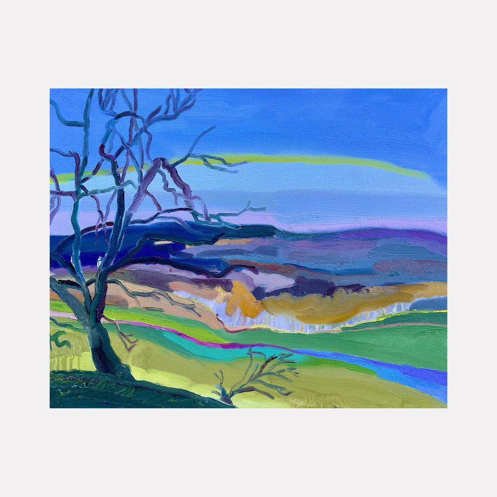 The artwork "Valley Stream" by Hana Yoshikawa presents a stylized New York landscape with bold, sinuous tree branches in deep blues and purples set against layered hills in soft greens, ochres, and muted lavenders beneath a vivid cerulean sky. The fluid, expressive brushwork evokes the atmospheric qualities reminiscent of early Milton Avery and the color sensitivity of Joan Mitchell.