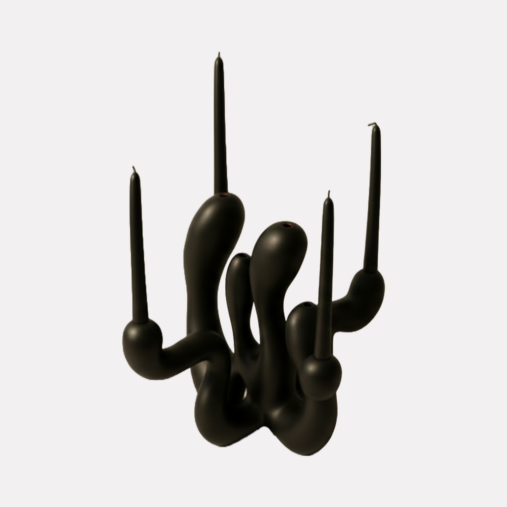 Hold the Light Sculptural Candleholder (Black) by Shadia Sabagh features a modern, abstract design with fluid, organic curves forming multiple candle holders in a matte black finish, blending artistic expression with functional elegance for a striking centerpiece.