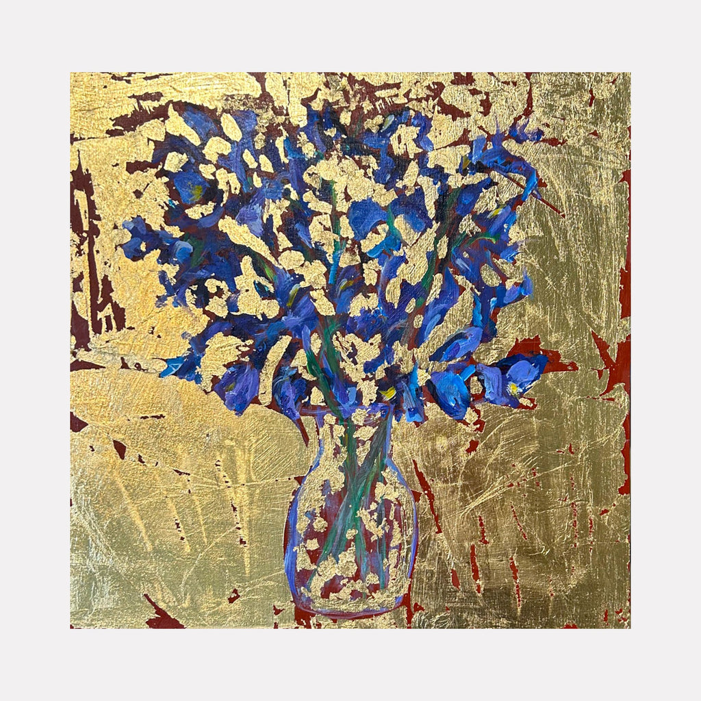 The artwork "Irises in glass vase" by Owen Brown features a vibrant still life of deep blue irises arranged in a transparent vase against a richly textured gold and rust background. The mixed media composition combines bold brushstrokes and delicate floral forms, evoking the luminous detail of Vincent van Gogh’s florals with a contemporary abstract edge.
