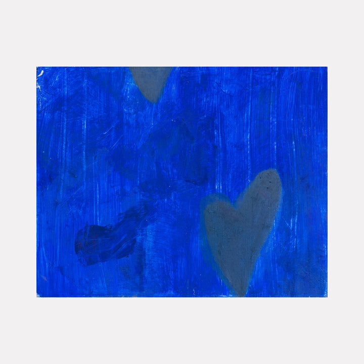 The artwork "where the eyelash wish lands" by Aliza Sternstein features a deep, textured cobalt blue background with subtle brush strokes and layered gradients. Soft gray heart shapes gently emerge from the abstract field, evoking a contemplative mood reminiscent of Mark Rothko’s color field paintings with minimalist, emotive qualities.